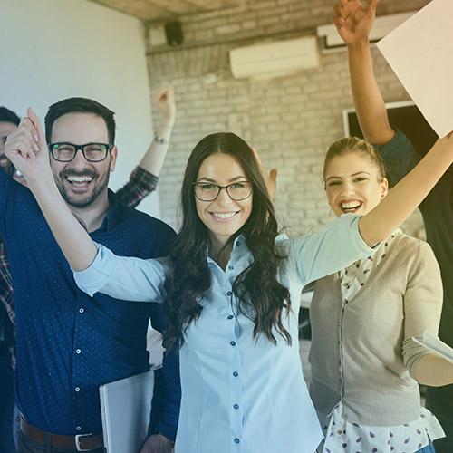 Portrait of successful business team posing in office